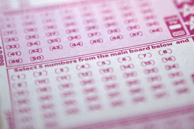 A mystery woman, known only as Miss C from Surrey, has won £10,000 a month for one year after matching the five main numbers in the Set For Life draw. Picture by SHAUN CURRY/AFP via Getty Images