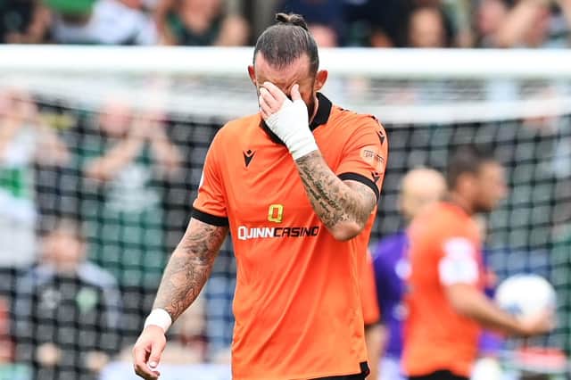 Dundee United striker Steven Fletcher reacts as Celtic score again. (Photo by Paul Devlin / SNS Group)