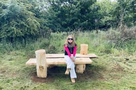 Justyna Stanka is pictured sitting on her competition-winning bench in Fortmonthills Woodland, Glenrothes.