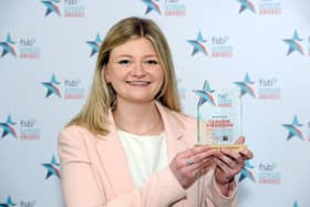 Claudia Kirkwood shows off her award