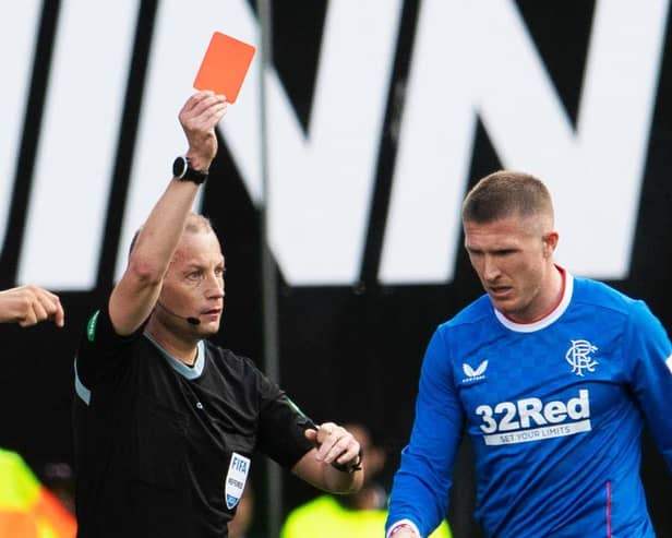 Referee Willie Collum shows Rangers midfielder John Lundstram a red card during the 2-2 draw with Hibs at Easter Road