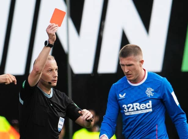 <p>Referee Willie Collum shows Rangers midfielder John Lundstram a red card during the 2-2 draw with Hibs at Easter Road</p>