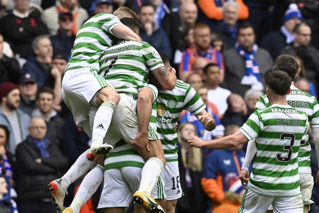 Celtic players celebrate Cameron Carter-Vickers' winner at Ibrox.  (Photo by Rob Casey / SNS Group)