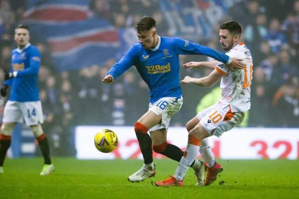 Nathan Patterson holds off a challenge from Dundee United striker Nicky Clark during Rangers' 1-0 win over the Tannadice side at Ibrox on Saturday. (Photo by Alan Harvey / SNS Group)