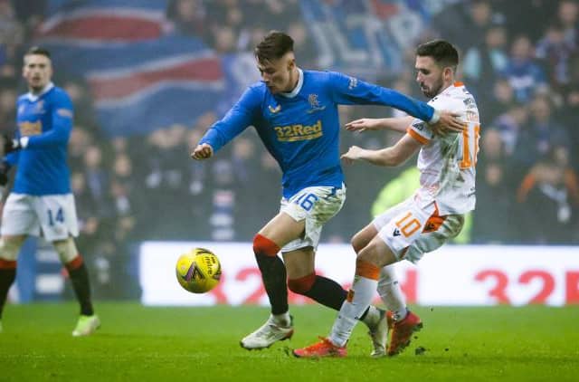 Nathan Patterson holds off a challenge from Dundee United striker Nicky Clark during Rangers' 1-0 win over the Tannadice side at Ibrox on Saturday. (Photo by Alan Harvey / SNS Group)