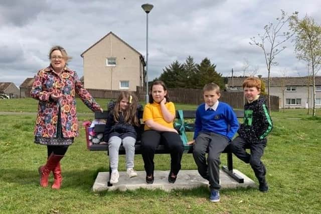 Pupils try out one of five new benches installed to encourage people to walk for short journeys.