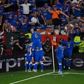 Players celebrate with fans after Rangers' Nigerian midfielder Joe Aribo scored the first goal of the UEFA Europa League final football match between Eintracht Frankfurt and Glasgow Rangers at the Ramon Sanchez Pizjuan stadium in Seville on May 18, 2022. (Photo by PIERRE-PHILIPPE MARCOU/AFP via Getty Images)