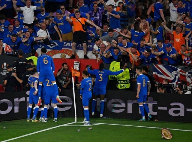 Players celebrate with fans after Rangers' Nigerian midfielder Joe Aribo scored the first goal of the UEFA Europa League final football match between Eintracht Frankfurt and Glasgow Rangers at the Ramon Sanchez Pizjuan stadium in Seville on May 18, 2022. (Photo by PIERRE-PHILIPPE MARCOU/AFP via Getty Images)