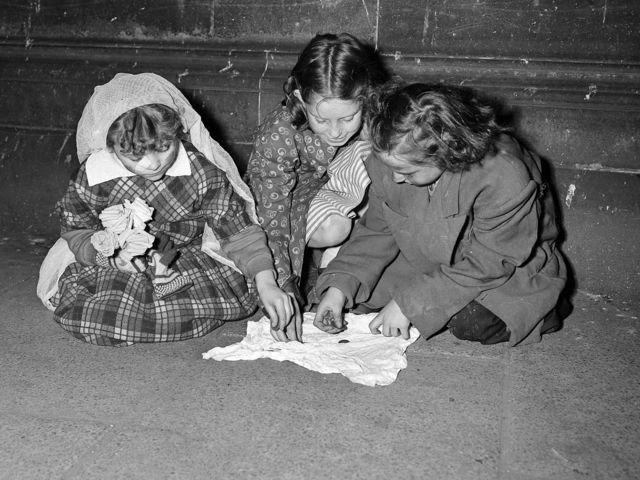 These children 'turn out' their guising money in 1951.