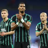 Moritz Jenz and the rest of the Celtic players applaud the travelling fans at the end of the 5-1 defeat to Real Madrid in the Bernabeu. (Photo by THOMAS COEX/AFP via Getty Images)