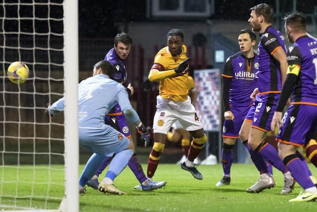 Devante Cole of Motherwell scoring his side's first goal in their 2-1 defeat of Dundee United. Photo: Steve Welsh