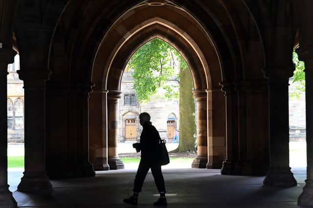 A student walks in the campus of Glasgow University. (Photo by Andy Buchanan / AFP) (Photo by ANDY BUCHANAN/AFP via Getty Images)