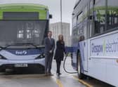 Duncan Cameron, MD for First Bus Scotland, shows Minister for Transport, Jenny Gilruth, around the Caledonian depot