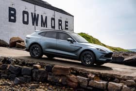 The DBX Bowmore Edition pictured at the Bowmore Distillery on Islay. Only 18 of the model, styled by Aston Martin's Q by Aston MArtin personalisation service will be released.