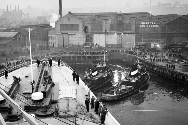 The view from the bridge as tugs guide the Queen Elizabeth II liner into John Brown's shipyard on the Clyde in November 1968.