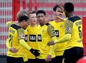 Dortmund's German forward Marco Reus with Jude Bellingham and team-mates (Photo by RONNY HARTMANN/AFP via Getty Images)