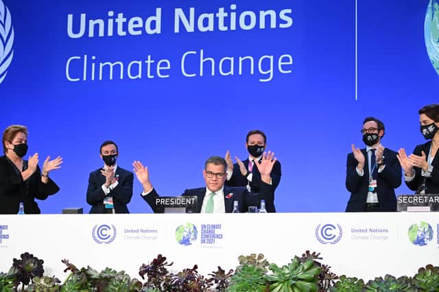 COP26 president Alok Sharma attempts to stop applause for his efforts as the summit ended in Glasgow amid what he called 'deep disappointment'.