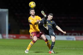 Motherwell’s Sean Goss battles for the ball with Livingston's Jason Holt in 'Well's last game on Boxing Day (Pics by Ian McFadyen)
