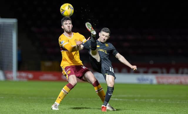 Motherwell’s Sean Goss battles for the ball with Livingston's Jason Holt in 'Well's last game on Boxing Day (Pics by Ian McFadyen)