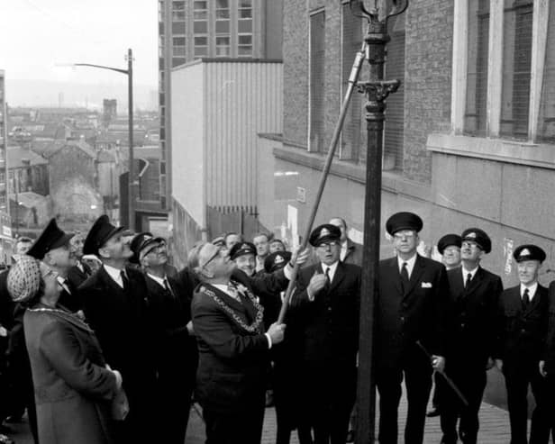 Lord Provost of Glasgow Sir Donald Liddle lights the last Glasgow gas street lamp in September 1971.