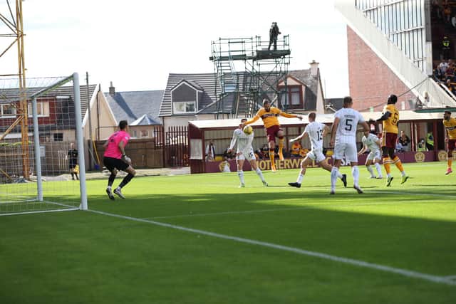 Kevin van Veen heads Motherwell into the lead against Hibs (Pic by Ian McFadyen)