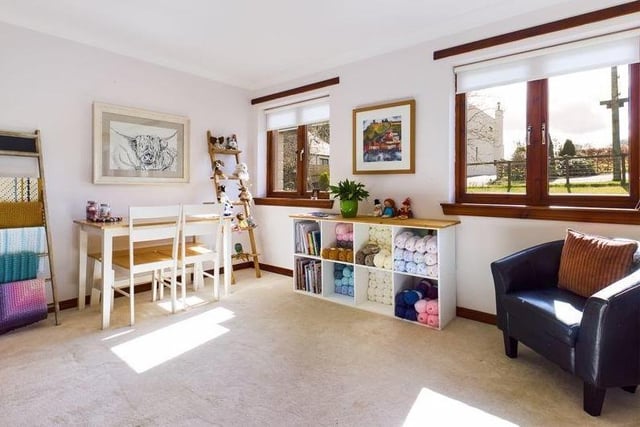 One of three double bedrooms in the ground floor wing, with built in sliding wardrobes, it is being used as a crafting room by the current owner.