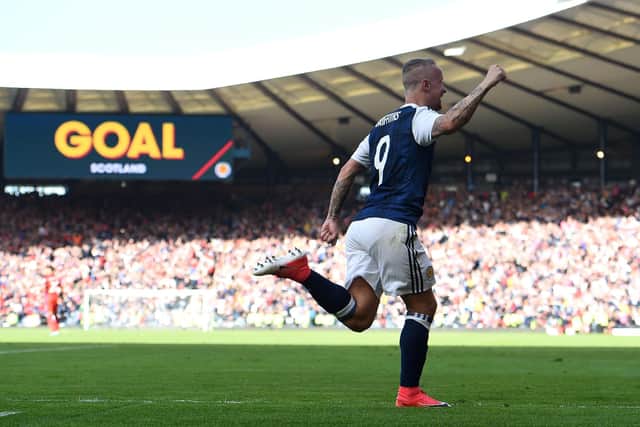 One of the great moments in Auld Enemy clashes, Leigh Griffiths celebrating the second of his free-kick goals in 2017 which could have, should have, brought us victory