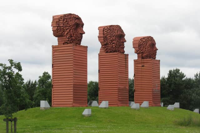Finished in 1999 and the last of the four, David Mach’s Big Heids sculpture is situated on the south side of the A8 trunk road, on the edge of the Eurocentral industrial and distribution base, just north of Holytown. The Big Heids sculpture is made up of three giant heads, each 33ft high and weighing 18 tons. Stood on upturned freight containers themselves measuring 23ft high, the heads are a tribute to Lanarkshire’s steel industry, being made of welded steel tubes similar to those once made at the former Clydesdale Steel Works at Mossend.