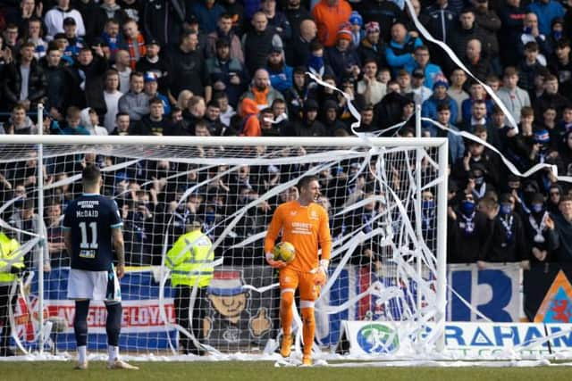 Play was stopped for the third time in the match at Dens Park on Sunday when Rangers fans again threw toilet rolls into the goalmouth. (Photo by Alan Harvey / SNS Group)