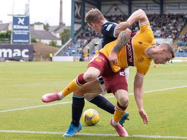 Matchwinner Lee Ashcroft of Dundee with Connor Shields of Motherwell