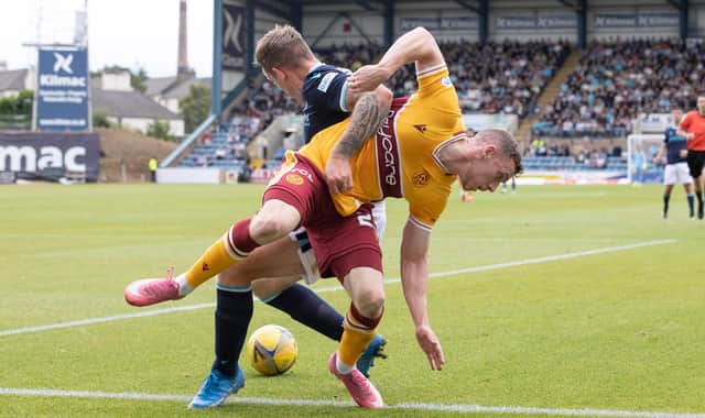 Matchwinner Lee Ashcroft of Dundee with Connor Shields of Motherwell