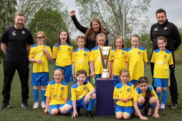Aileen Campbell showing the Scottish Women's Cup to one of the girls' teams (Photo: Kevin Ramage)