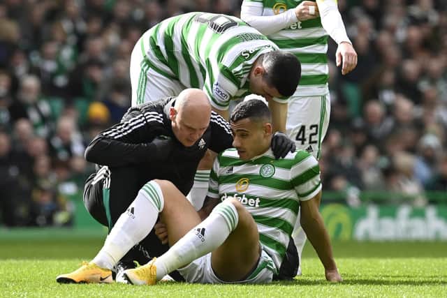 Celtic's Giorgos Giakoumakis goes down injured as he recieves treatment from the physio during the 7-0 win over St Johnstone. (Photo by Rob Casey / SNS Group)
