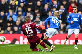 Motherwell's Dan Casey tackles Rangers' Ross McCausland, who was unable to continue. (Photo by Rob Casey / SNS Group)