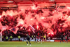 Rangers fans light up the Bob Shankly Stand at Dens Park with pyro during the recent cinch Premiership match against Dundee.  (Photo by Rob Casey / SNS Group)