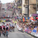 France's Benoit Cosnefroy leads a group of riders along George Square in Glasgow during day four of the 2023 UCI Cycling World Championships in Glasgow. Image: Tim Goode/PA Wire.