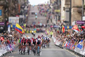 France's Benoit Cosnefroy leads a group of riders along George Square in Glasgow during day four of the 2023 UCI Cycling World Championships in Glasgow. Image: Tim Goode/PA Wire.