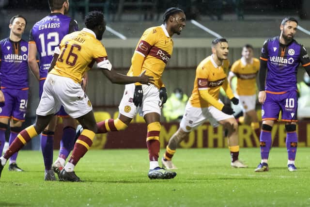 Devante Cole of Motherwell celebrating scoring his side's first goal against Dundee United. Photo: Steve Welsh