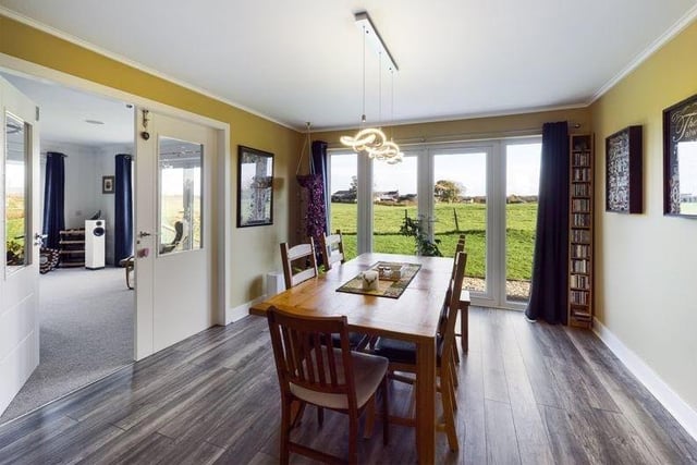 The dining room also benefits from doors leading into the garden, perfect for al fresco entertaining.