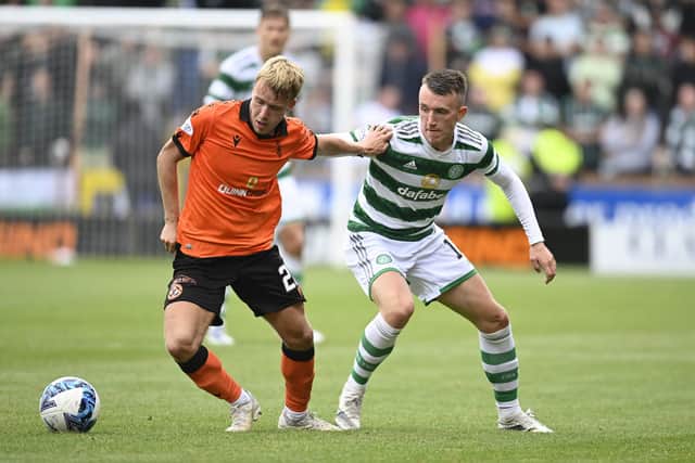 Dundee United's Kieran Freeman holds off David Turnbull during the 9-0 defeat to Celtic. (Photo by Rob Casey / SNS Group)