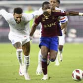 Connor Goldson thwarts Dereck Kutesa during Rangers 1-1 draw against Servette in Geneva.