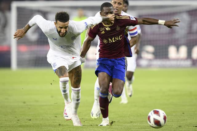 Connor Goldson thwarts Dereck Kutesa during Rangers 1-1 draw against Servette in Geneva.