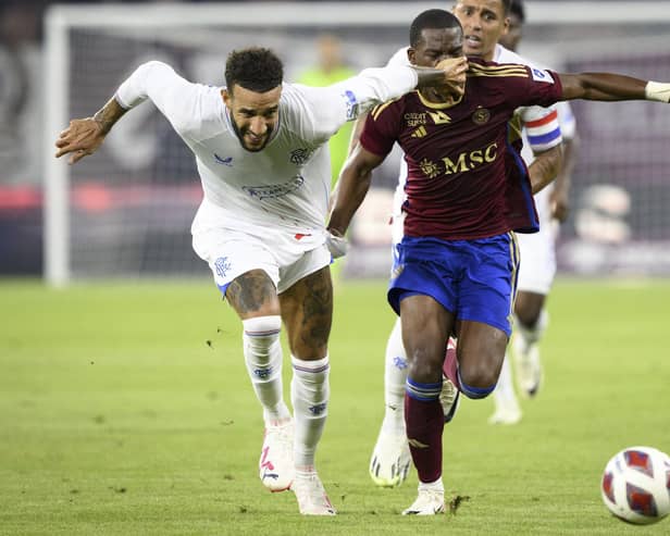 Connor Goldson thwarts Dereck Kutesa during Rangers 1-1 draw against Servette in Geneva.