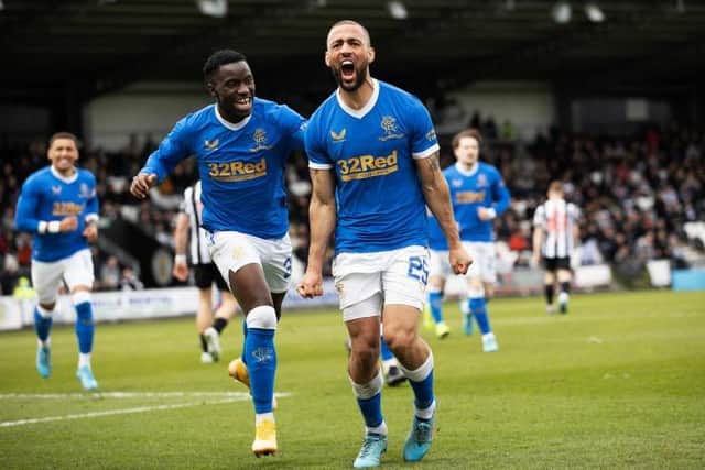 Kemar Roofe (right) celebrates with Fashion Sakala after completing his hat-trick in Rangers' 4-0 win at St Mirren on Sunday. (Photo by Craig Williamson / SNS Group)