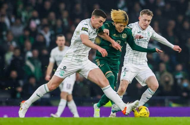 Celtic's Kyogo Furuhashi in action alongside Paul Hanlon and Jake Doyle Hayes during the Premier Sports Cup Final between Celtic and Hibernian at Hampden Park, on December 19, 2021, in Glasgow, Scotland. (Photo by Alan Harvey / SNS Group)