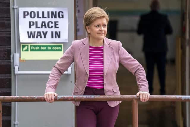 First Minister Nicola Sturgeon poses for the media outside the Broomhouse Community Hall polling station, Glasgow, as voters went to the polls.