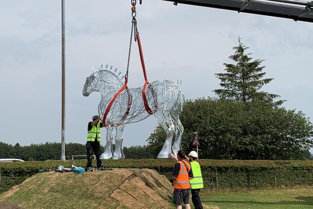 A crane was used to transport the statue on to its plinth near the auction market.