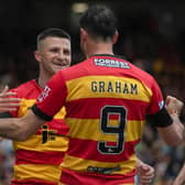 Partick's Aidan Fitzpatrick celebrates his opener with Brian Graham, who went on to score Thistle's second in the 2-0 win over Ross County. (Photo by Craig Foy / SNS Group)