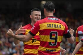 Partick's Aidan Fitzpatrick celebrates his opener with Brian Graham, who went on to score Thistle's second in the 2-0 win over Ross County. (Photo by Craig Foy / SNS Group)