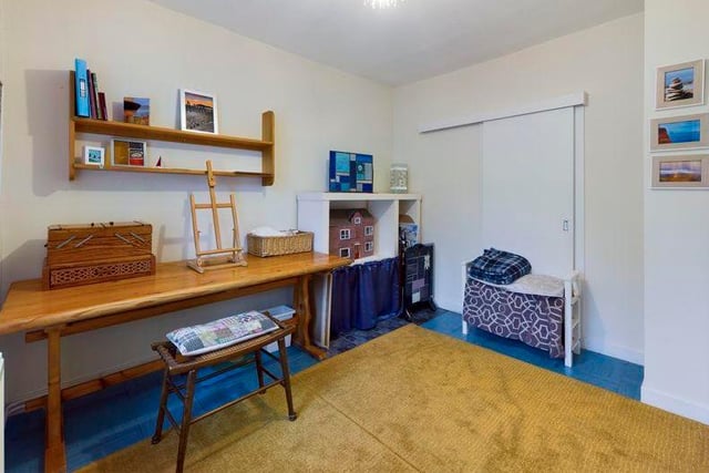 The downstairs bedroom has access to a shower room, which can also be accessed from the main hallway. Currently used as an art studio, it offers plenty of flexibility for the new owners.